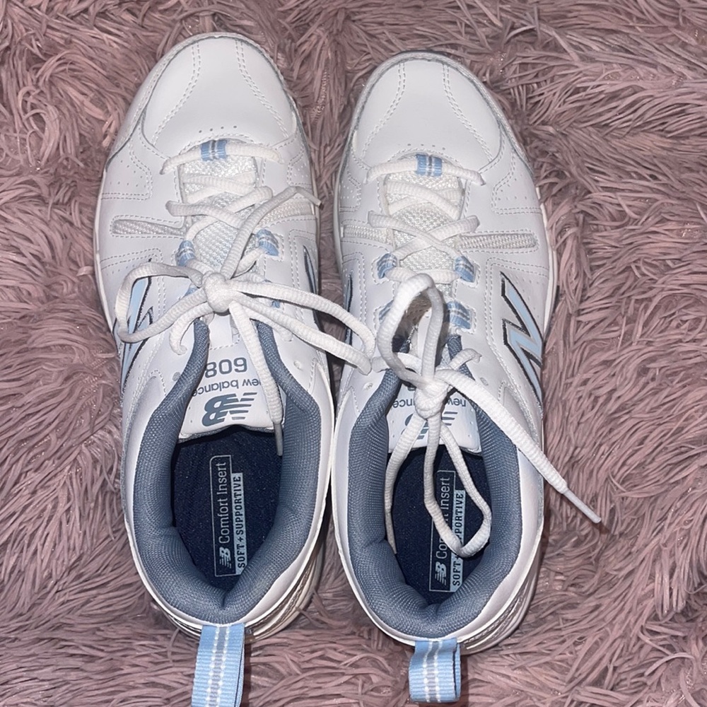 White and blue new balance running shoes.